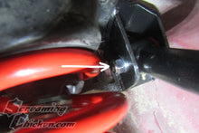 Hardware installed with an aftermarket upper control arm